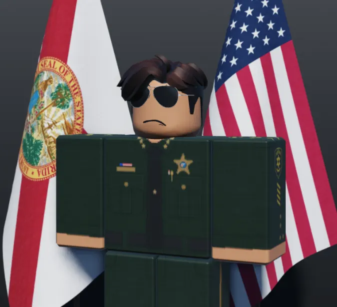 Sheriff Noah Richards in uniform in front of the Florida and United States flags